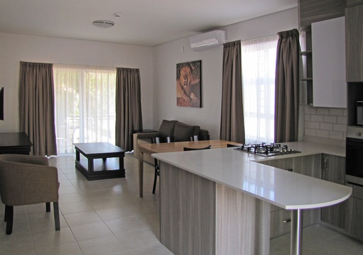 Apartments @ 125 - 2 bedroom unit; dining area, lounge including smart enabled TV